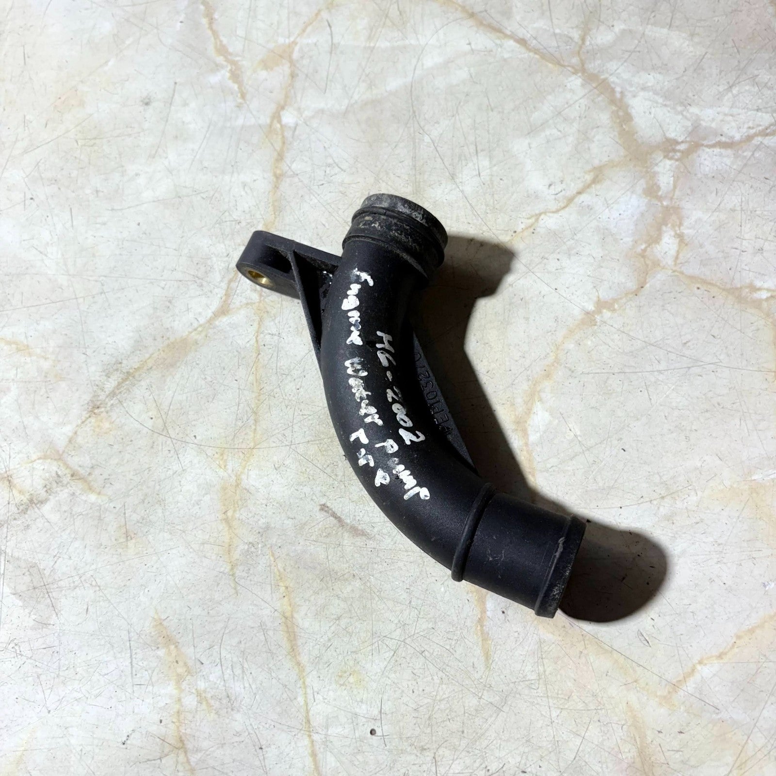MG 2002 ENGINE WATER PUMP PIPE
