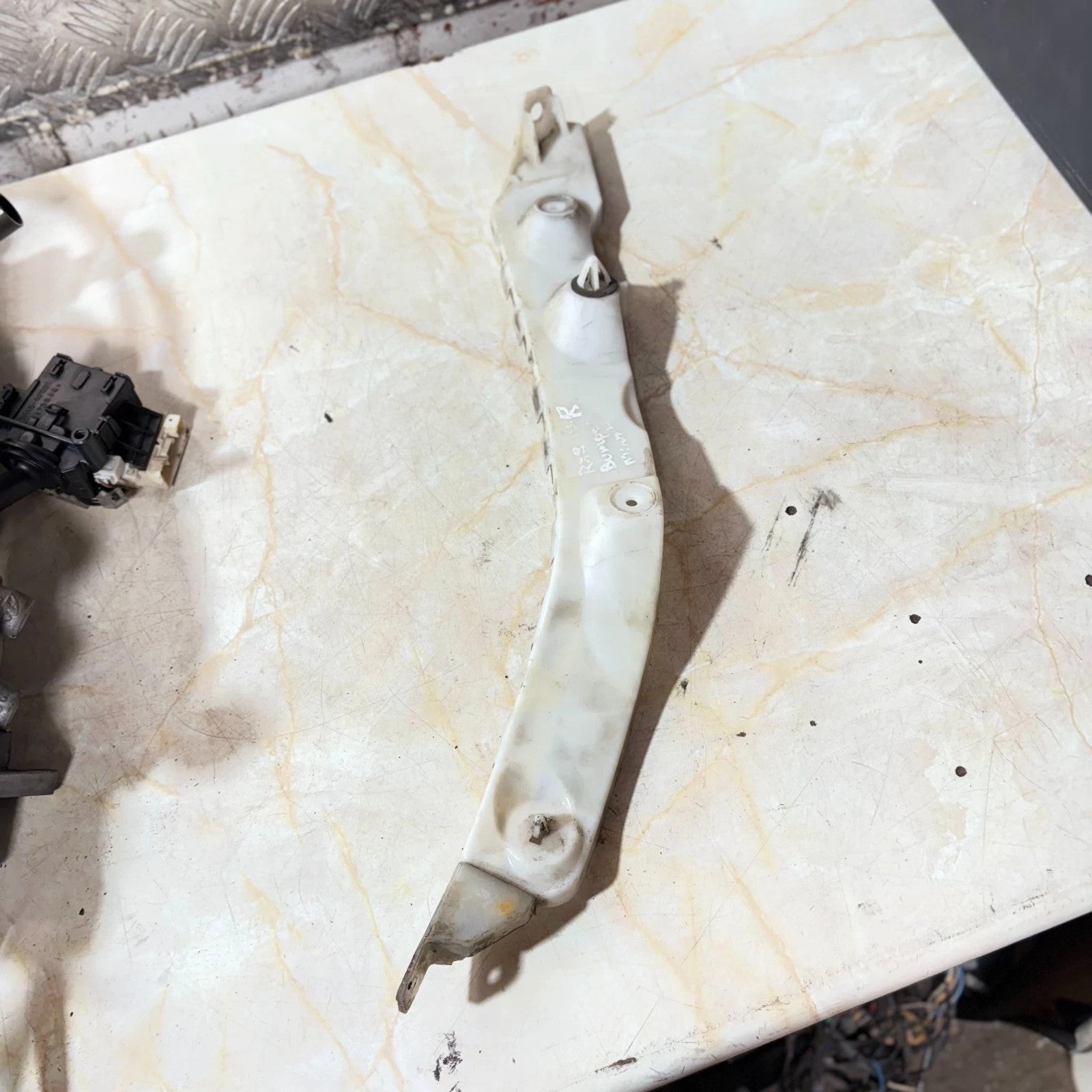 MAZDA RX-8 05-11 LEFT REAR BUMPER BRACKET